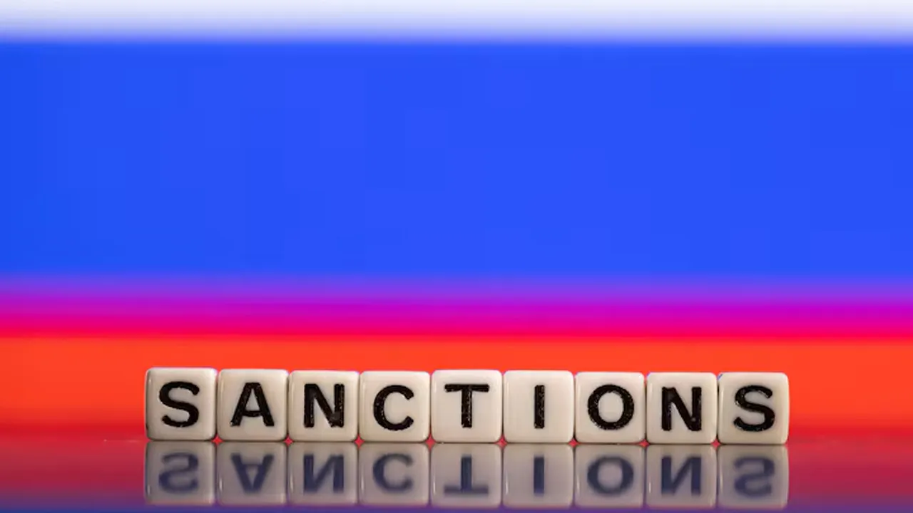 Plastic letters arranged to read "Sanctions" are placed in front of Russian flag colors in this illustration taken February 25, 2022. REUTERS