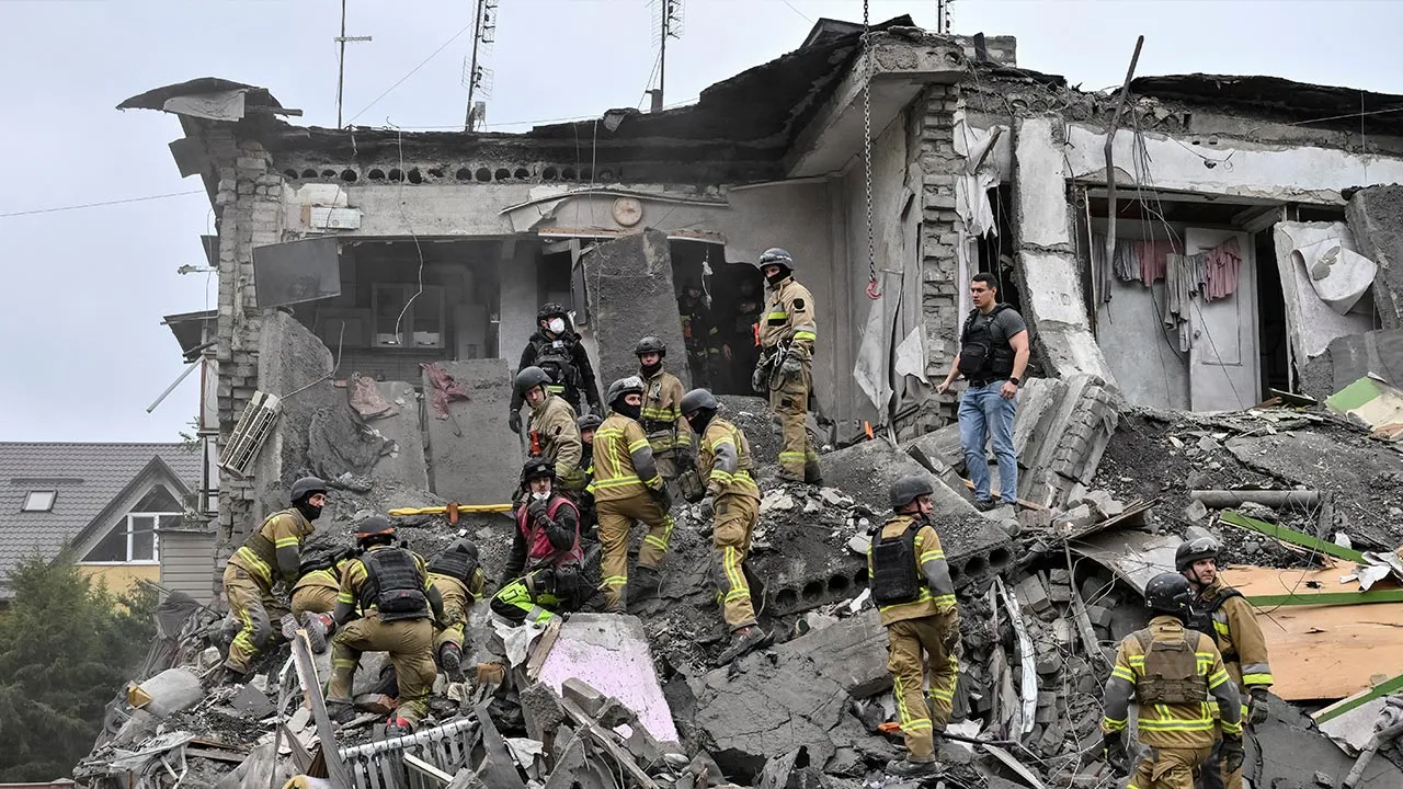 Rescuers work at a site of an apartment building damaged during a Russian air strike, amid Russia's attack on Ukraine, in Zaporizhzhia, Ukraine, October 10, 2026. REUTERS/Stringer