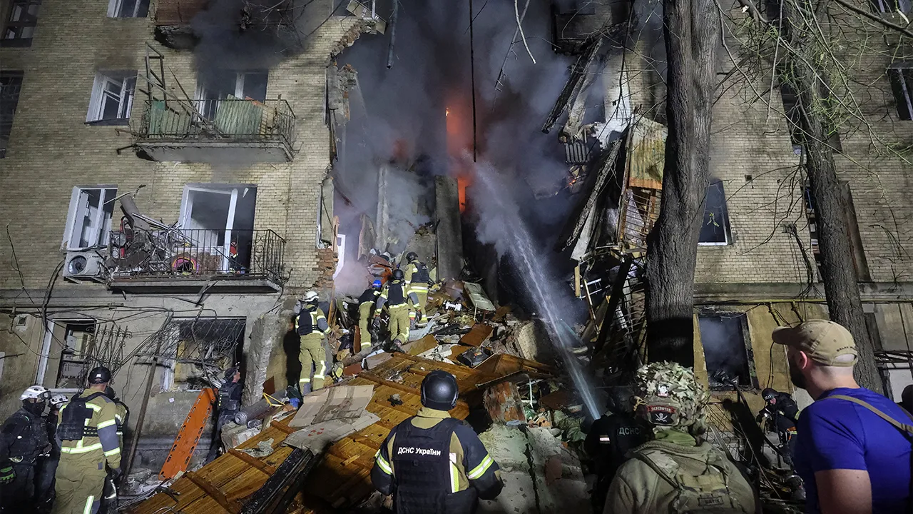 Rescuers work at the site of an apartment building damaged during a Russian drone strike, amid Russia's attack on Ukraine, in Kharkiv, Ukraine, October 12, 2026. REUTERS