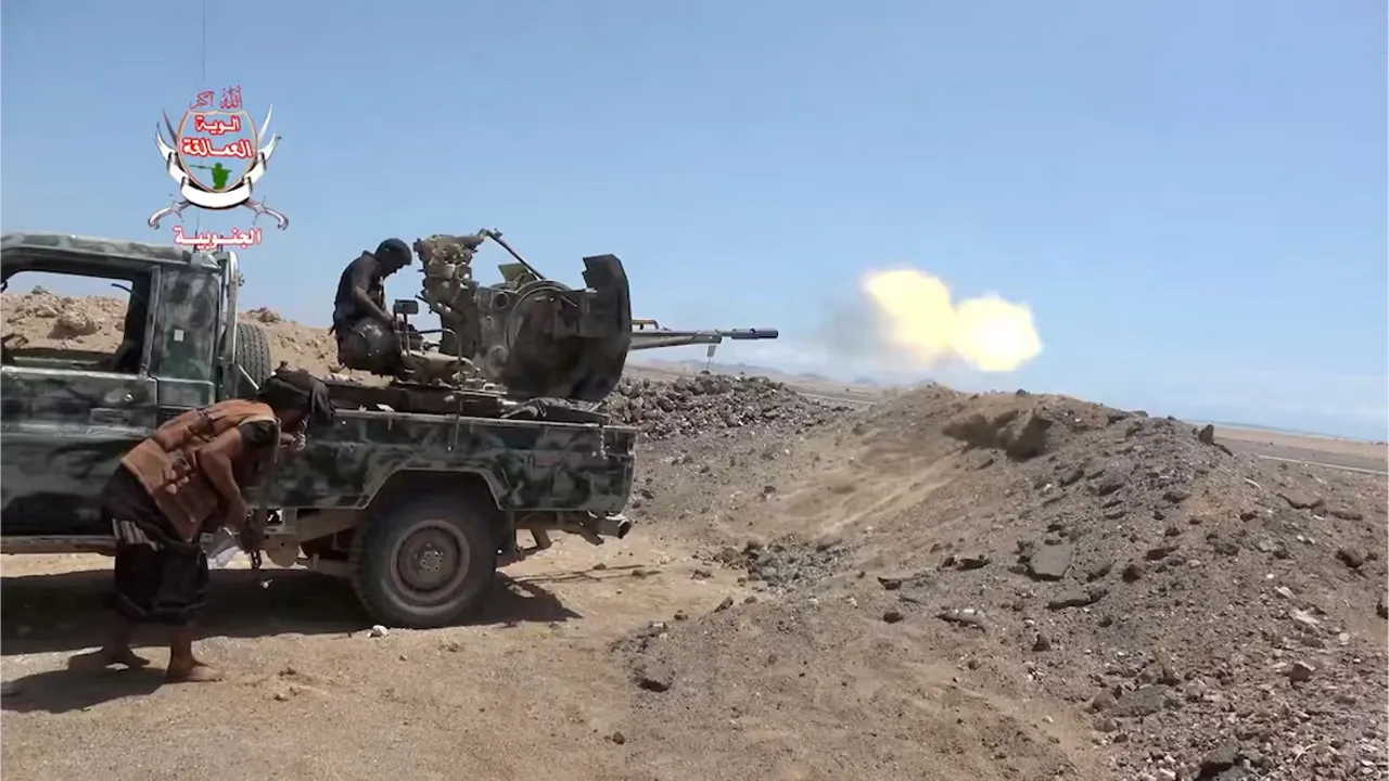 A Saudi-backed Yemeni government fighter fires a vehicle-mounted weapon during what government forces say was an advance against the Houthis in Taiz governorate. Photo: handout via Reuters