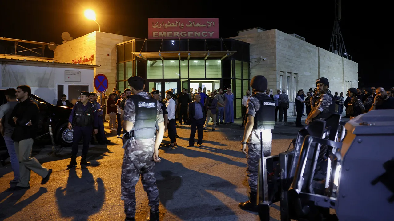 Gendarmerie forces stand guard outside of Al-Karak Government Hospital, where some of the injured are receiving treatment after gunmen opened fire during a funeral at Hamoud Church, in Karak, Jordan, October 23, 2026. REUTERS/Alaa Al-Sukhni