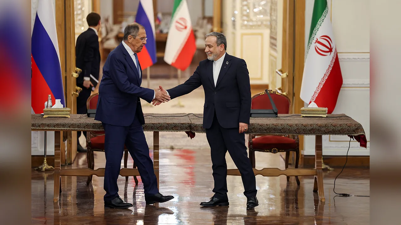 Iran's Foreign Minister Abbas Araghchi shakes hands with Russia's Foreign Minister Sergei Lavrov during their meeting in Tehran, Iran, October 19, 2026. Majid Asgaripour/WANA (West Asia News Agency) via REUTERS ATTENTION EDITORS - THIS PICTURE WAS PROVIDED BY A THIRD PARTY. ISRAEL OUT. NO COMMERCIAL OR EDITORIAL SALES IN ISRAEL. NO ACCESS FOR ISRAELI MEDIA. NO USE BBC PERSIAN. NO USE VOA PERSIAN. NO USE MANOTO. NO USE IRAN INTERNATIONAL. NO USE RADIO FARDA. DIGITAL: NO USE BBC PERSIAN. NO USE VOA PERSIAN. N