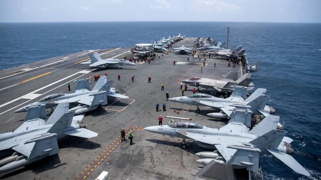 U.S. Navy sailors work on the flight deck of the aircraft carrier USS George Washington as it transits the Arabian Sea to support U.S. military operations in the war with Iran August 20, 2026. U.S. Navy/Handout via REUTERS