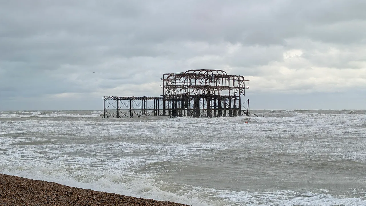 Pieces of the West Pier in Brighton, England, fall off into the sea as Storm Austen sweeps across the South West, on Friday, Oct. 23, 2026. (Jamie Lashmar/PA via AP)