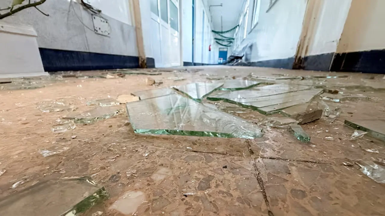 Pieces of shattered glass are scattered across the floor of a hospital following an airstrike on a nearby building in Sanaa, Yemen, October 3, 2026. REUTERS/Adel Al Khader