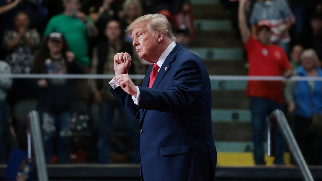 US President Donald Trump dances during a rally, in support of Republican US Senate candidate, former US Representative Mike Rogers, ahead of the midterm elections, at an entertainment complex in Port Huron, Michigan, US, October 25, 2026. REUTERS/Jonathan Ernst