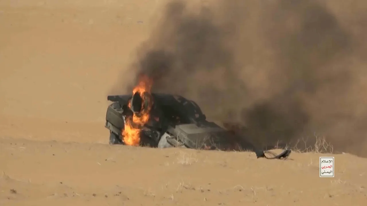 Fire burns in a vehicle in a location given as Marib Governorate, Yemen, after what Houthi military media said was the targeting of government forces' armoured vehicles, in this screengrab obtained from a video released October 12, 2026. Houthi Military Media/Handout via REUTERS