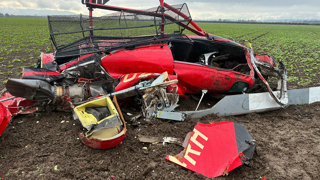 This photo released by the Yamhill County Sheriff's Office shows a damaged helicopter after two helicopters collided and crashed into a farm field in Yamhill County, Ore., Thursday, Oct. 29, 2026. (Yamhill County Sheriff's Office via AP)