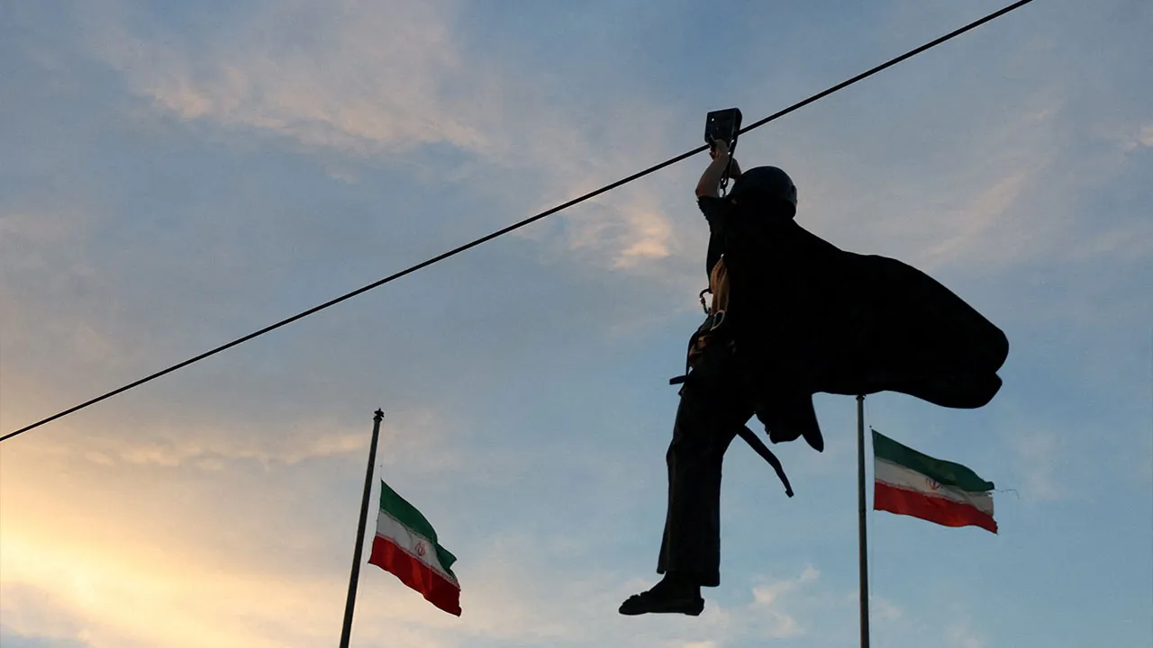 An Iranian woman volunteer uses a zipline as she receives military training at a military training center for ordinary citizens at Imam Hussein Square in central Tehran, Iran, October 4, 2026. Majid Asgaripour/WANA (West Asia News Agency) via REUTERS ATTENTION EDITORS - THIS PICTURE WAS PROVIDED BY A THIRD PARTY. ISRAEL OUT. NO COMMERCIAL OR EDITORIAL SALES IN ISRAEL. NO ACCESS FOR ISRAELI MEDIA. NO USE BBC PERSIAN. NO USE VOA PERSIAN. NO USE MANOTO. NO USE IRAN INTERNATIONAL. NO USE RADIO FARDA. DIGITAL: N