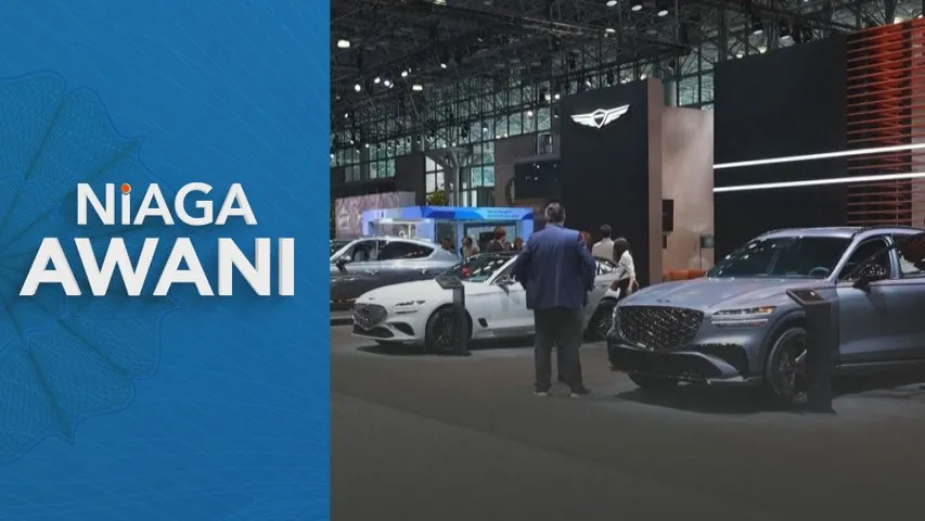 Automakers push EVs despite market slump